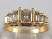 Appraisal: A yellow metal tests carat gold round brilliant and baguette