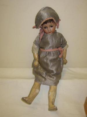 Appraisal: A Gebruder Ohlhaver bisque head girl doll with blue glass