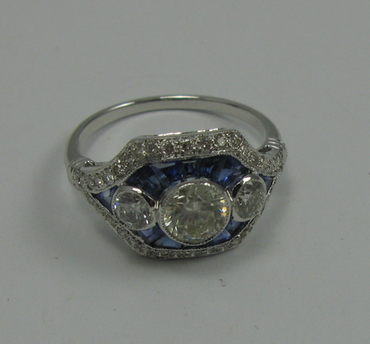 Appraisal: SAPPHIRE DIAMOND AND K WHITE GOLD RING set with facet-cut