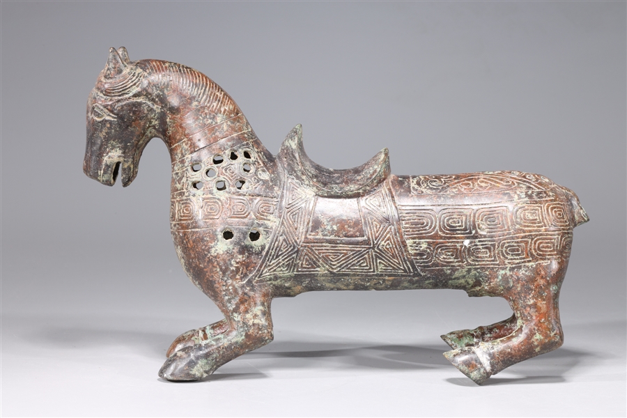 Appraisal: Chinese archaistic bronze model of a horse with intricate incised