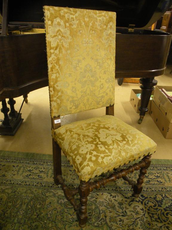 Appraisal: A Continental oak side chair upholstered in textured velvet