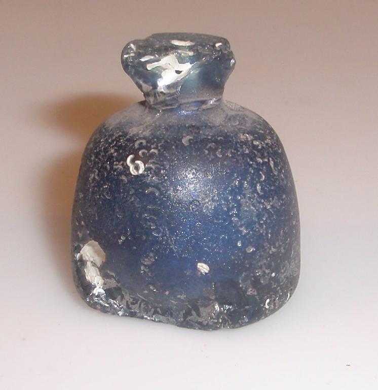 Appraisal: A blue Islamic glass chess-piece with a solid dome-shaped body