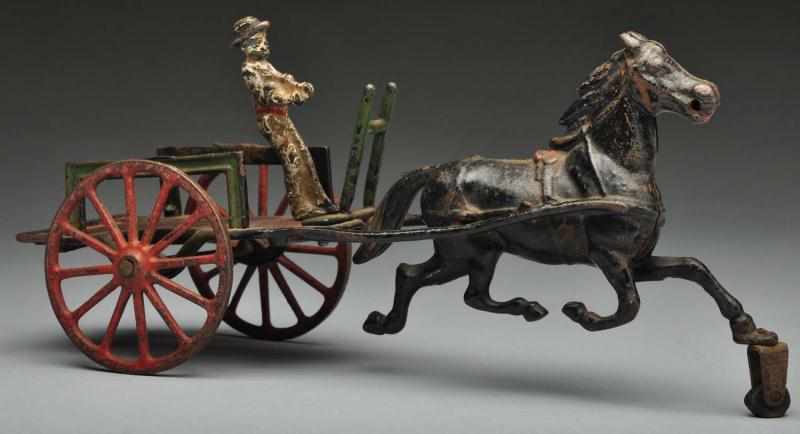 Appraisal: Cast Iron Road Car Horse-Drawn Toy Description American Made by