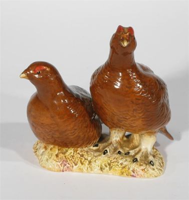 Appraisal: Grouse pair ' model a Beswick bird figure painted in