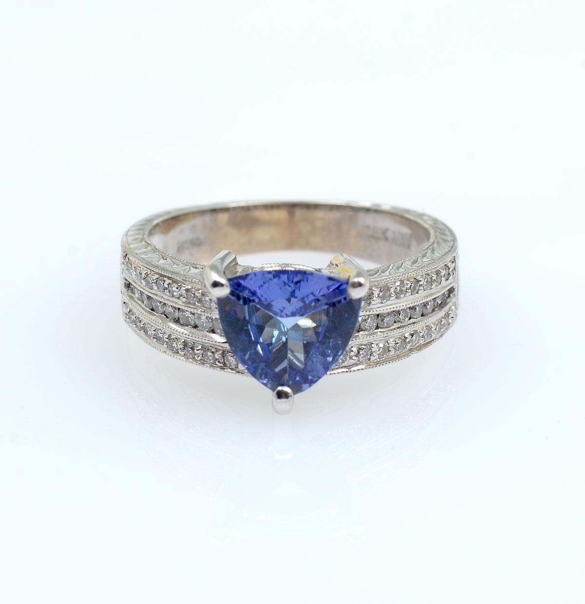 Appraisal: PLATINUM K TANZANITE DIAMOND RING CT triangular cut tanzanite is