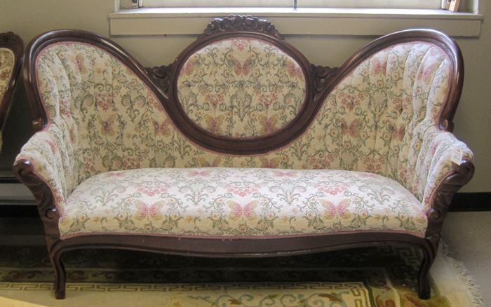 Appraisal: A VICTORIAN STYLE MEDALLION-BACK SOFA American th century having a