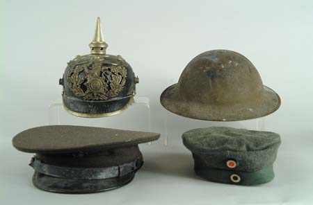 Appraisal: LOT OF WWI AND WWII UNIFORMS AND HELMETS Included is