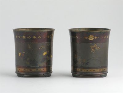 Appraisal: A pair of Japanese mixed metal beakers finely decorated with