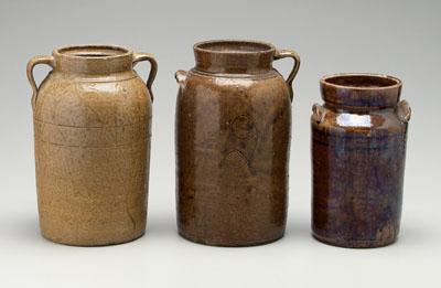 Appraisal: Three alkaline glaze churns one with two handles medium mottled