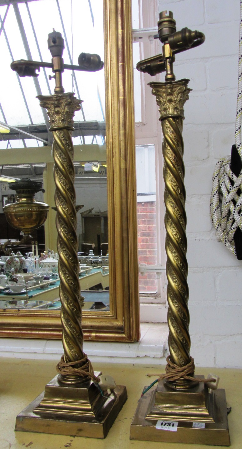 Appraisal: A pair of gilt brass table lamps with spiral turned