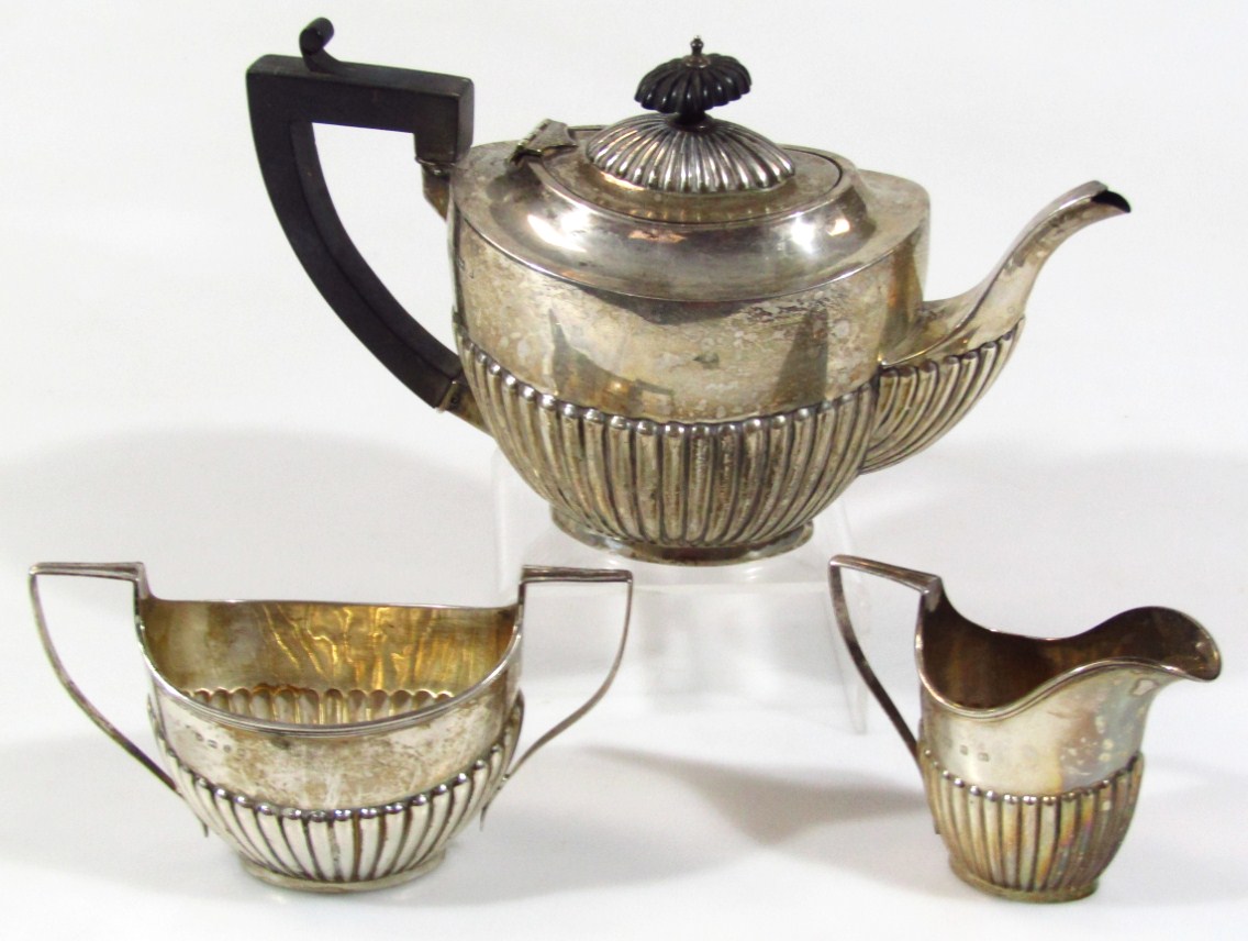 Appraisal: A matched late Victorian and Edwardian three piece bachelor's tea