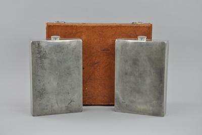 Appraisal: A Calf Leather Prohibition Case with Oversized Flasks Designed by