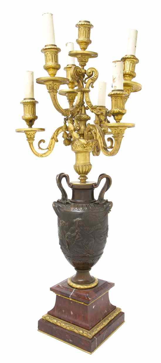 Appraisal: A French Gilt and Patinated Bronze Seven-Light Candelabrum having a