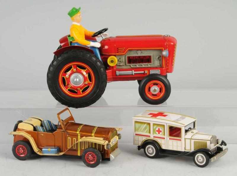 Appraisal: Lot of Tin Vehicle Friction Battery-Op Toys Description Japanese Working