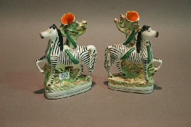 Appraisal: A Staffordshire matched pair of spill vases modelled as a