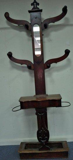 Appraisal: A Victorian mahogany hall stand the central mirror flanked scroll