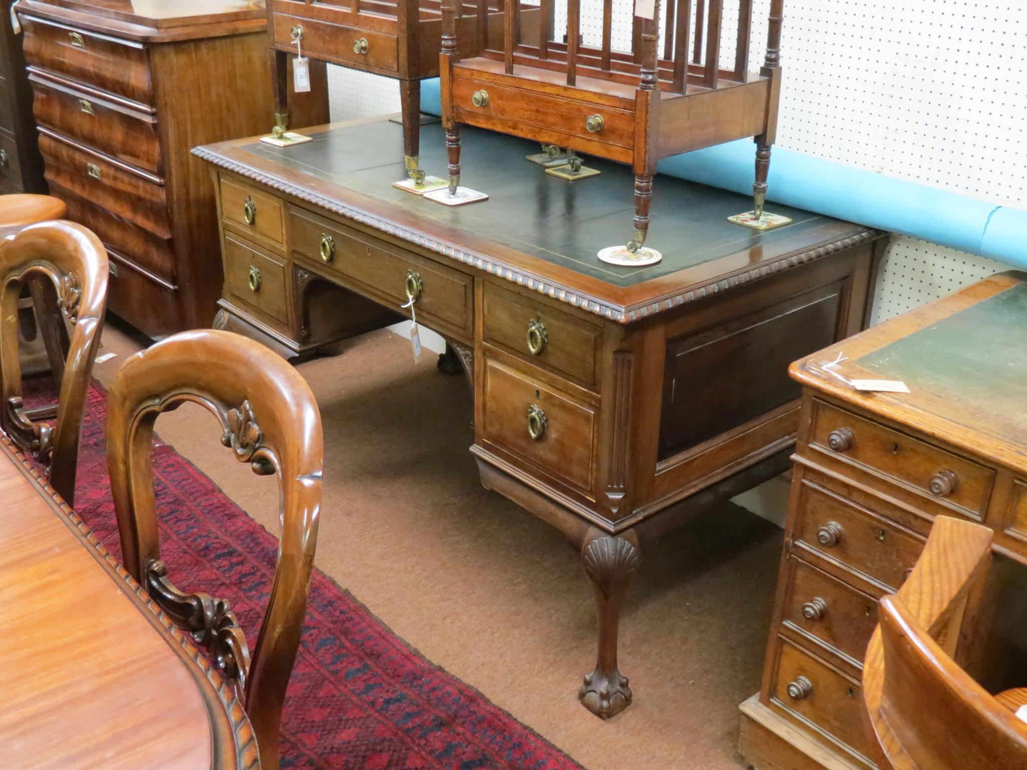 Appraisal: An early th century Chippendale-style mahogany desk inset leather top