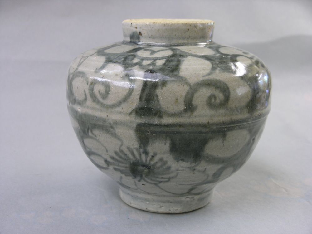 Appraisal: A Ming vase painted with primitive flowers and leaves in