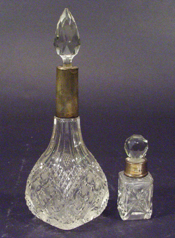 Appraisal: Two silver collared cut glass scent bottles largest cm high