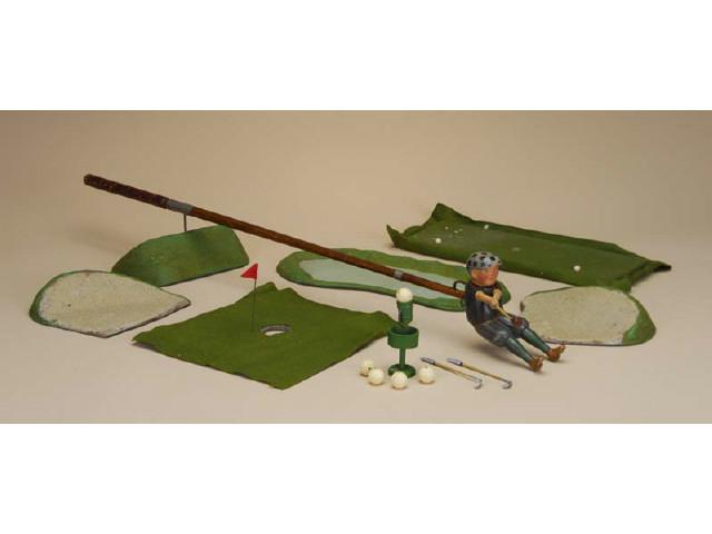 Appraisal: Schoenhut Golfer and Course America ca painted metal and composition