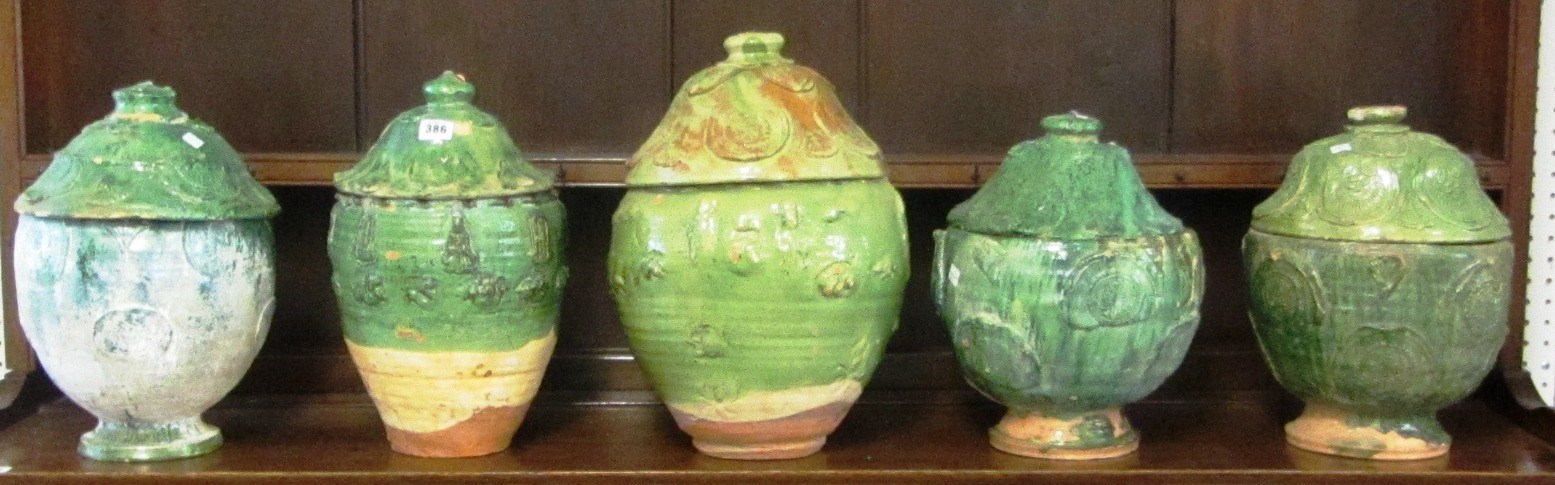 Appraisal: A group of five Chinese green glazed offering vessels Ming