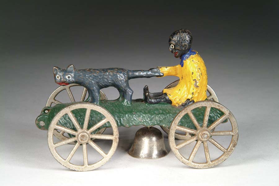 Appraisal: CAT AND NEGRO BOY BELL TOY Manufactured by N N