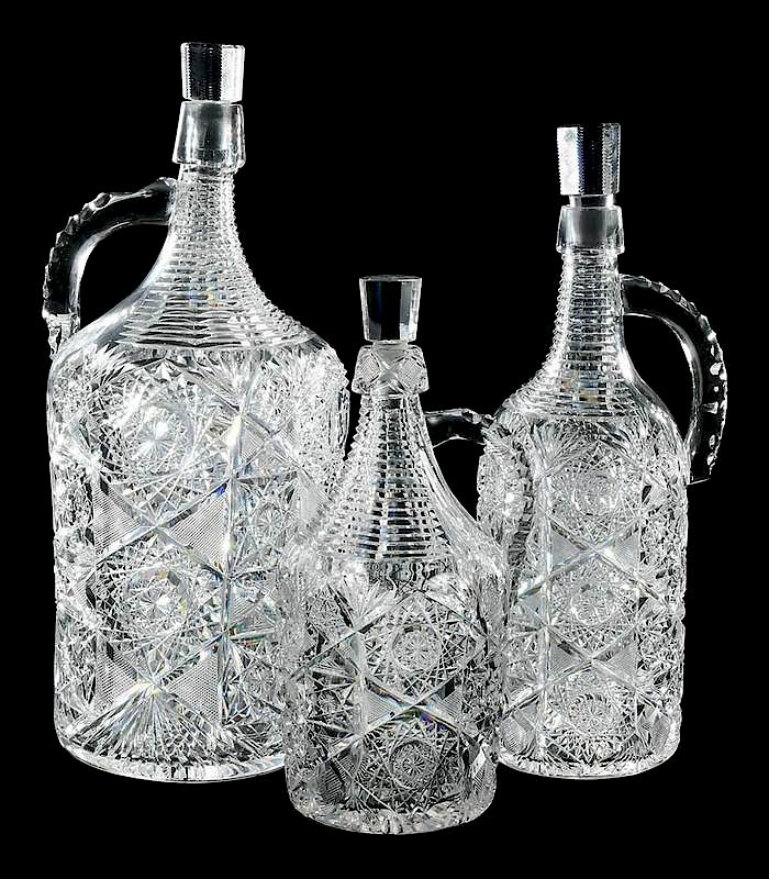 Appraisal: Three Cut Glass J Hoare Demijohns Monarch pattern overall heights