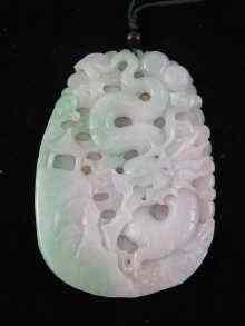 Appraisal: A large Chinese jade pendant carved on one side with