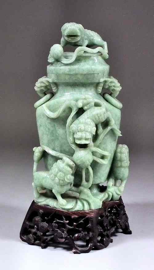 Appraisal: A Chinese mid green jadeite two-handled urn shaped vase and