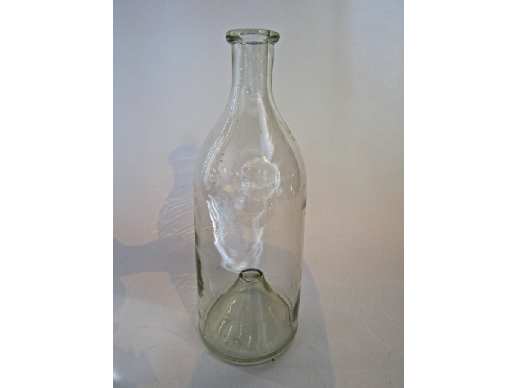 Appraisal: A vintage clear hand blown glass minnow trap with hollow