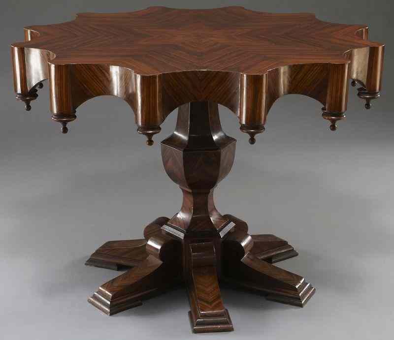 Appraisal: Italian rosewood center table the top book matched veneered to