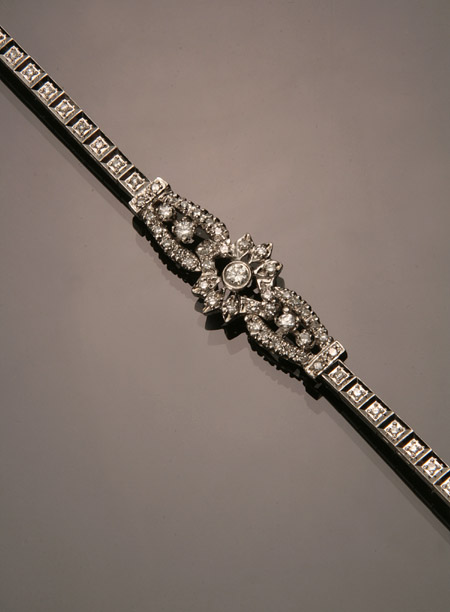 Appraisal: -Karat White-Gold and Diamond Bracelet The central floral motif set