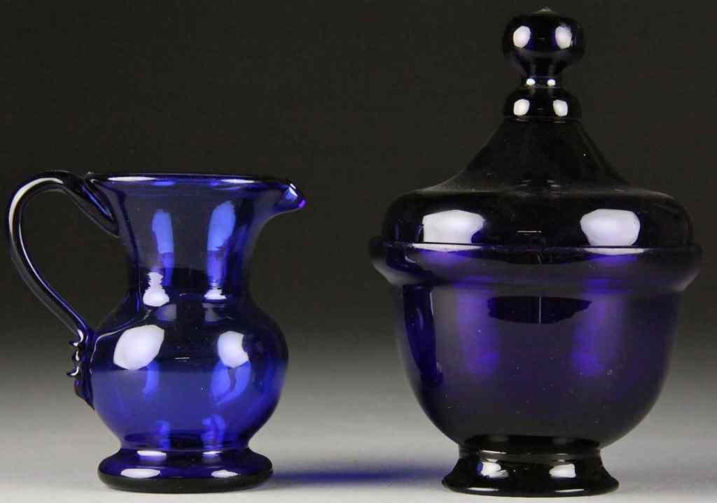 Appraisal: An American Blown Glass Creamer Sugar th C Each of