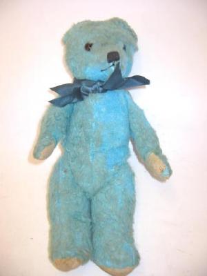 Appraisal: A turquoise teddy bear covered in plush with swivel joints