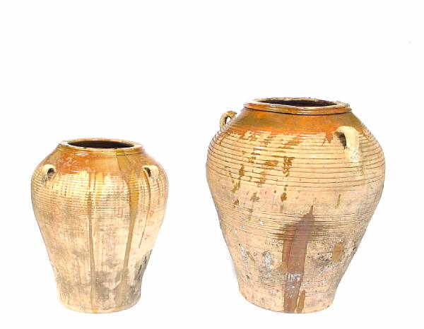 Appraisal: A group of two partial glazed earthenware storage jars height