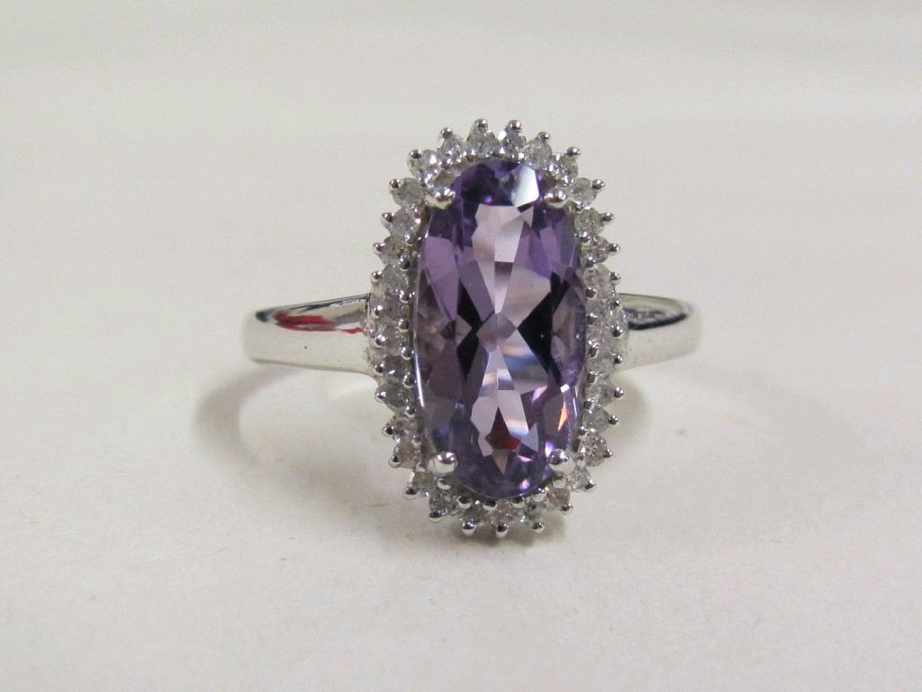 Appraisal: Nine carat white gold amethyst and diamond cluster ring