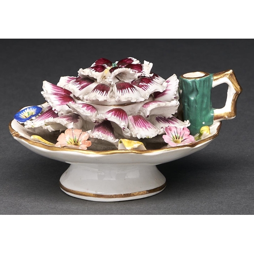 Appraisal: A Staffordshire carnation shaped and floral encrusted handled inkwell and