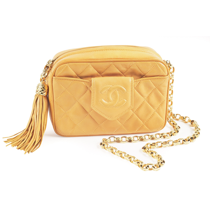 Appraisal: Chanel handbag Italy mustard-colored lambskin with original matching leather tassel