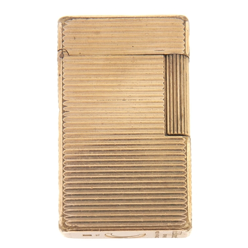 Appraisal: An S T Dupont gold plated cigarette lighter More Information