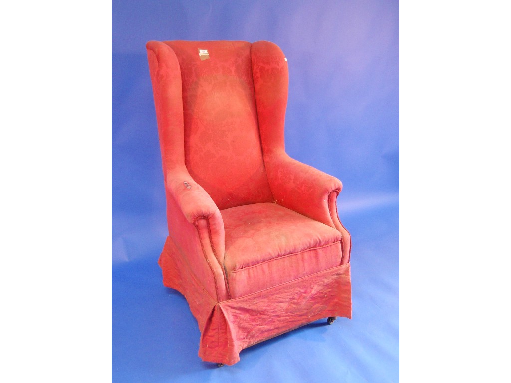 Appraisal: A Georgian style high back wing armed chair with raised