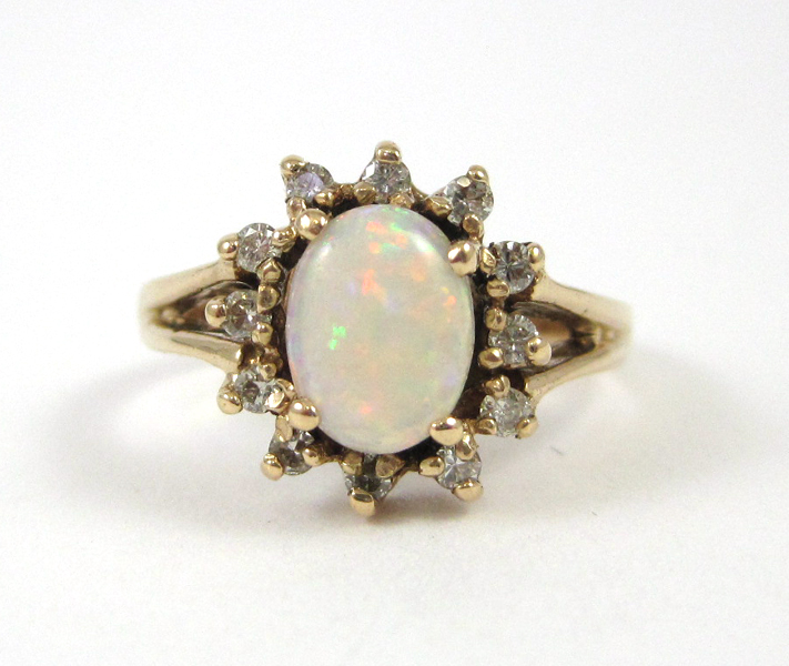 Appraisal: OPAL DIAMOND AND FOURTEEN KARAT GOLD RING with twelve round-cut