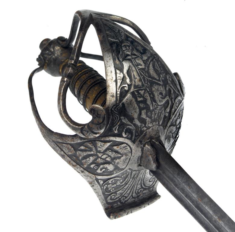 Appraisal: AN ENGLISH BASKET-HILTED BACKSWORD the associated tapering blade faintly inscribed