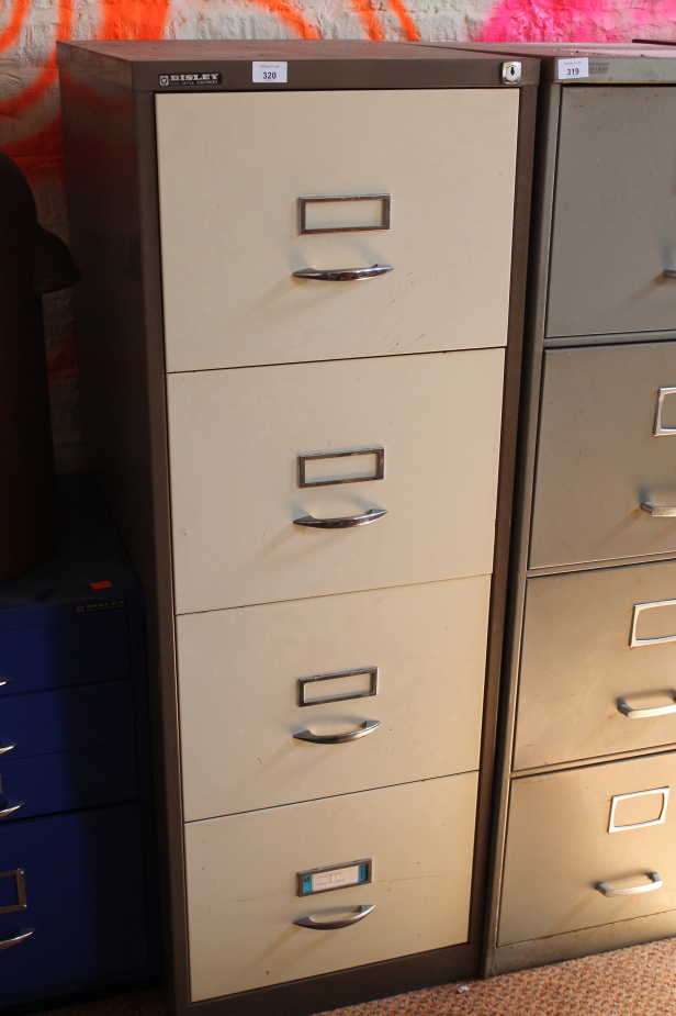 Appraisal: A brown cream four drawer filing cabinet