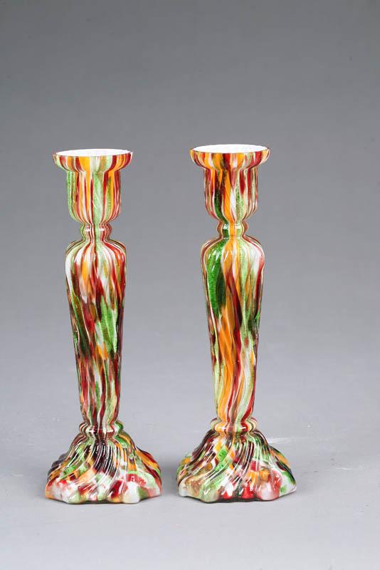 Appraisal: TWO GLASS CANDLESTICKS Matching spatter glass candlesticks in oarnge red