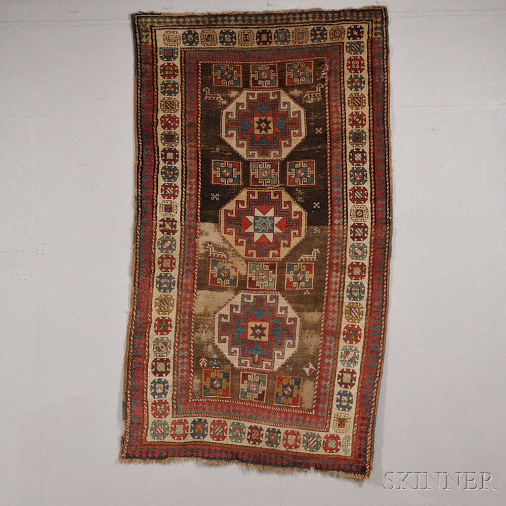 Appraisal: South Caucasian Rug late th century the abrashed brown field