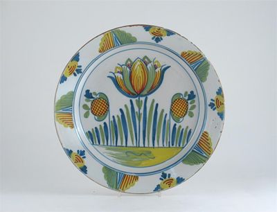 Appraisal: A Delftware dish painted with a tulip design in polychrome