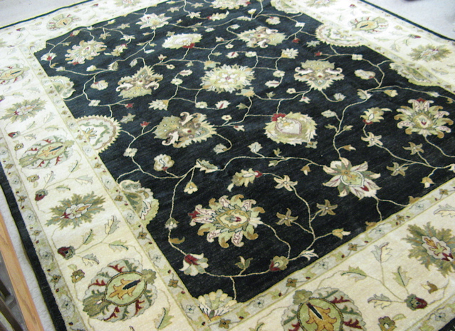 Appraisal: HAND KNOTTED ORIENTAL CARPET Pakistani Zeigler Persian floral design on