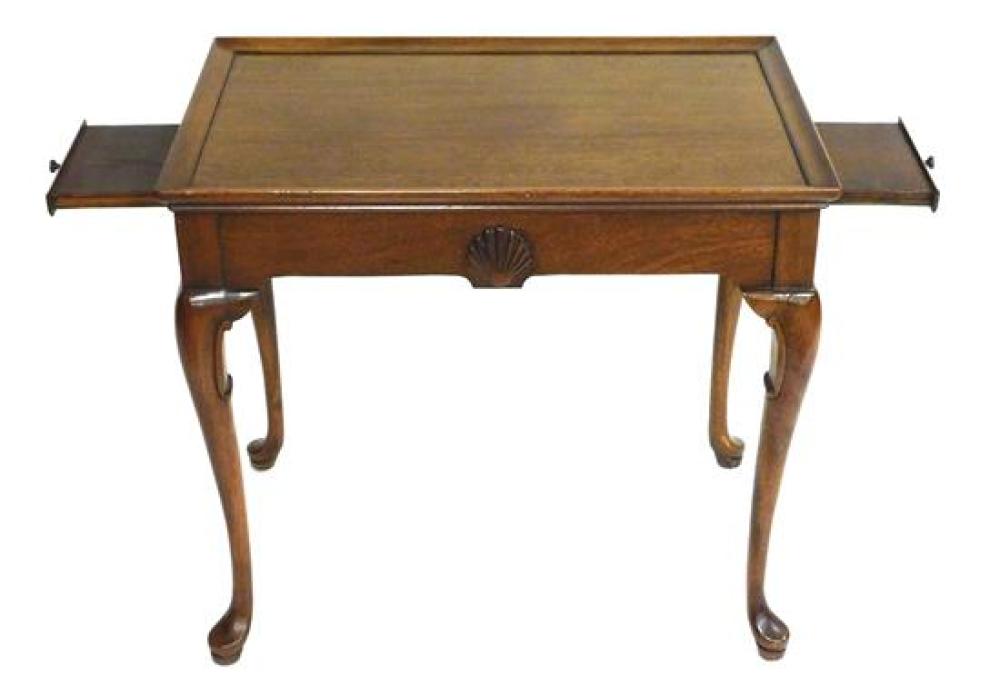 Appraisal: Queen Anne reproduction tea table with shell carved frieze mahogany