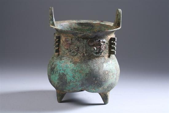 Appraisal: CHINESE ARCHAIC BRONZE TRIPOD VESSEL Western Zhou period Cast with