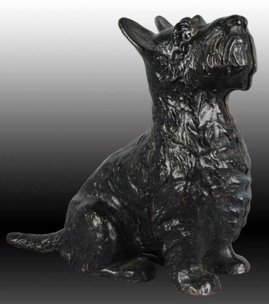 Appraisal: Sitting Scottie Dog Cast Iron Doorstop Description Made by Spencer